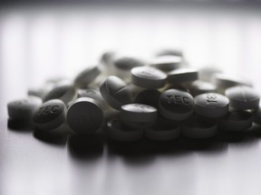 Prescription pills containing oxycodone and acetaminophen are shown in this June 20, 2012 photo. THE CANADIAN PRESS/Graeme Roy
