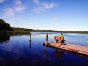 Sitting on the dock at Moonshine Lake Provincial Park. The park park located in Alberta, Canada. Located 27 Kms west and 7 Kms north of Spirit River, on Highway 49.