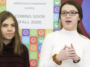 Members of the youth committee for Sarnia's Access Open Minds centre Maura Cook (left) and Janessa Labadie, both 16, address dignitaries gathered at 190 Front St. in Sarnia in December 2019. The Lambton County-owned former downtown bank branch has been selected as the site for the mental health and addictions-focused facility for 11-25-year-olds. File photo/Postmedia Network