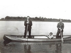 Francis, Marie and Manley Fraleigh (in his RCAF uniform) in canoe on the Snye in front of their home. Photo taken Friday, Sept. 5, 1941, just four days before F/O Fraleigh started learning to fly the Fleet Finch at No 3 Elementary Flying Training School at London, Ontario. Manley's sister, Mary, died July 27, 1941, at age 13.  Photo from F/O Fraleigh's photo album.