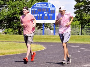 The Todd Eaton Memorial Track is a well-used community resource at Lakewood Elementary School in Port Dover. The Grand Erie District School Board approved $354,330 last week for a complete upgrade. Legging it out on a beautiful summer day last week were Dawson McKeen, left, and Austin Bradt, both of Port Dover. – Monte Sonnenberg photo