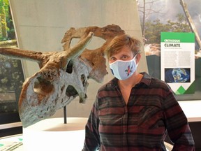 Executive Director Linden Roberts stands before a dinosaur skull at the Philip J. Currie Dinosaur Museum just outside of Wembley, Alta. on Thursday, June 25, 2020. The museum will reopen on Canada Day after being closed for over three months due to COVID-19.