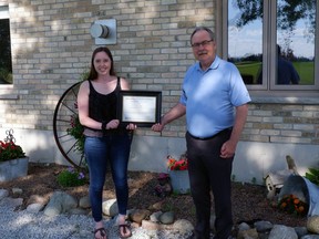 Gracie Goodhill is awarded the Mary Jo Arnold Conservation Scholarship by St. Clair Region Conservation Authority chairperson, Joe Faas.