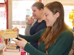 Stephanie Giseler and Nicole Oshell pile their purchases on the counter at Allison the Bookman in North Bay during its 45th-year celebration in 2018.
Nugget File Photo