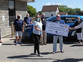 Rotary District 6380 governor Don “Sparky” Leonard and other Rotary officials hand over a $26,722 cheque to Chatham-Kent Health Alliance Foundation president and CEO Mary Lou Crowley and CKHA president and CEO Lori Marshall on June 24. (Handout/Postmedia Network)