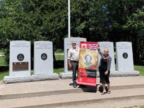 Photo by Sharleen Alexander-Sissons/For The Mid-North MonitorJoyce Daigle and husband Peter hold a banner honouring Joyce’s mother, Thelma ‘Tommie’ Dagg at the Decoration Day ceremonies on Manitoulin Island.