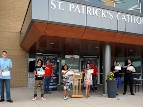 Award winners from the Lambton Youth Short Film competition pick up their prizes at Sarnia’s St. Patrick’s Catholic High School. From left to right: Joseph Barclay (Northern Collegiate Institute), Lucian Austin (St. Patrick's CHS), LaFFF/Forest Optimist Club’s Scott Ferguson, Isabela Gorgonio (St.  Patrick's CHS), Sarah Houle (St.  Patrick's CHS), LaFFF/Forest Optimist Club’s Ron Van Horne, Matthew Pettit (St.  Patrick's CHS) and Josiah Pettit (St. Patrick's CHS).