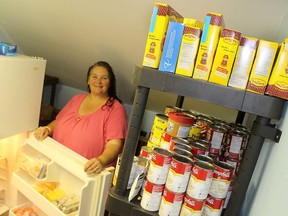 Loree Bailey, general manager of Chatham Hope Haven, says the donation of a refrigerator, plus the influx of food from the May 16 Miracle food drive, has enabled the local men's shelter to provide a food bank on Mondays from noon to 4 p.m. to anyone in the community in need. Ellwood Shreve/Postmedia Network