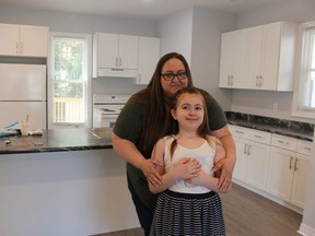 Kelly Edwards and her 10-year-old daughter, Piper Burd, stand in their new home on Bright Street in Sarnia. It was the 60th home project for Habitat for Humanity in Sarnia-Lambton. Paul Morden/Postmedia Network