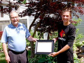 Brady Grubb (right) is awarded with the A.W. Campbell Memorial Scholarship by St. Clair Region Conservation Authority chair Joe Faas. Grubb is a graduate of Lambton Kent Composite School in Dresden. Submitted