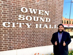 Waleed Aslam stands in front of Owen Sound city hall. SUPPLIED