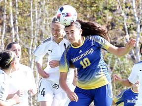 Catherine Rocca of the Laurentian Voyageurs women's soccer team and Sarah Zutauen of the Carleton Ravens fight to head the ball during OUA soccer action  in Sudbury, Ont. on Sunday October 1, 2017. Laurentian defeated Carleton 3-0. The men lost 3-1 to Carleton.