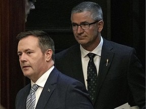 Alberta Premier Jason Kenney, left, and Alberta Finance Minister Travis Toews, right.