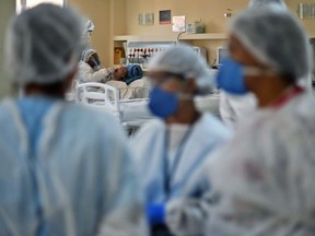 A COVID-19 patient is treated at the Oceanico hospital in Niteroi, Rio de Janeiro on June 22, 2020, during the coronavirus pandemic. 
CARL DE SOUZA / AFP