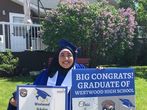 Asfa Nazir enjoying the cap and gown distribution event by Westwood staff. Photo by Jeff Landry, Computer Science Teacher at Westwood Community High School