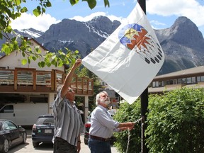 Canmore Mayor John Borrowman, and Tribal Historian Buddy Wesley from Stony Nakoda, raised the Treaty 7 flag outside the Civic Center in Canmore on June 21, to celebrate the unique heritage, diverse cultures, and outstanding achievements of the nation's aboriginal peoples from the Stoney Nakoda, Blackfoot, Dene, Ktunaxa, and Métis of Treaty 7 territory and surrounding lands. Photo Marie Conboy.