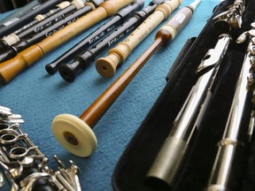 A bagpipe chanter, foreground centre, a clarinet, left, and flute, right, lie on a table with some recorders at the Stirling Musical Instrument Lending Library. Loans have resumed via curbside service only.