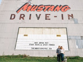 Drew Downs and Dawn Laing along with their dog Wilma are pictured in front of the Mustang Drive-In on Scoharie Road (County Rd. 1). The pair purchased the property in April and hope to open on July 1.