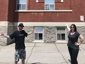 Artist Christopher Bennett and Hastings and Prince Edward District School Board trustee Lisa Anne Chatten show off the wall at the Education Centre that will soon have a mural paying tribute to essential workers during the current pandemic. BRUCE BELL