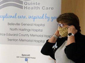 Quinte Health Care president and chief executive officer Mary Clare Egberts dons a mask Wednesday, June 10, 2020 at Belleville General Hospital in Belleville, Ont. She was among the officials reporting on pandemic-related issues during the June 24 online board meeting. Luke Hendry/The  Intelligencer/Postmedia Network