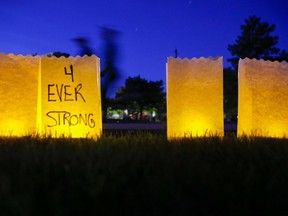 Participants in the annual Relay for Life  Saturday, June 16, 2018 at Mary-Anne Sills Park in Belleville, Ont. walk past luminary candles dedicated to people fighting cancer or who have died from it  About 200 people participated. Luke Hendry/Belleville Intelligencer/Postmedia Network FOR PAGINATORS: Participants in the annual Relay for Life Saturday night walk past luminary candles dedicated to people fighting cancer or who have died from it. About 200 people participated at Mary-Anne Sills Park. See more photos on page A3. Luke Hendry/The Intelligencer