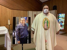 Rev. Peter Ciallella, pastor of Blessed Sacrament Parish in Burford, holds a memorial mass Sunday for Juan Lopez Chaparro, a migrant farm worker from Mexico who died of COVID-19. Vincent Ball