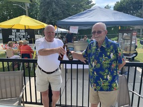 Andy Moran (left), president of the Royal Canadian Legion, Branch 29, in Paris and longtime legion member Henry Foster enjoy legion hall's patio on Saturday.