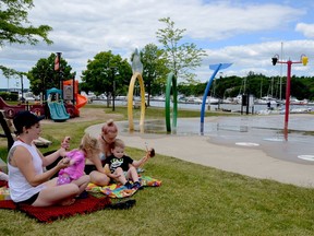 MAKING A SPLASH AGAIN
After weeks of lockdown, Brie Pauze, left, and her two-and-a-half-year-old twins, Freyja and Jeffrey Pauze, accompanied by Aunt Jerica Hawkins of Seeley's Bay, went out to enjoy the newly reopened splash pad at Joel Stone Park in Gananoque Saturday.