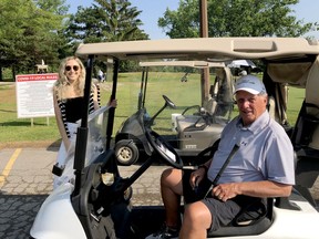 Lauren Phillips, event manager at the Brockville and District Hospital Foundation, poses with Friends of Palliative Care Golf Tournament co-chairman Dave Publow at the Brockville Country Club on Tuesday morning. (RONALD ZAJAC/The Recorder and Times)
