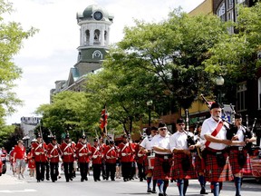 The Brockville Pipes and Drums and the Brockville Infantry Company join a sunny Canada Day parade from city hall on King Street in 2019. (FILE PHOTO)