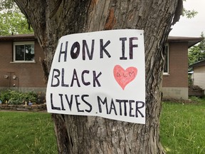 A sign on a tree on Windsor Drive urges motorists to support Black Lives Matter. (RONALD ZAJAC/The Recorder and Times)