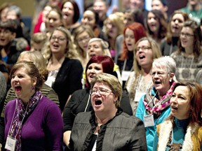 Singing and dancing in outdoor areas of restaurants, bars, food trucks or any similar establishment will constitute a violation of Ontario's Emergency Management and Civil Protection Act, it was revealed June 16. As for churches, singing is being discouraged. File photo shows singing church members in Edmonton in 2013. File photo/Postmedia Network