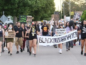 Marchers take part in a Black Lives Matter demonstration Friday on King Street in Chatham. Mark Malone/Postmedia
