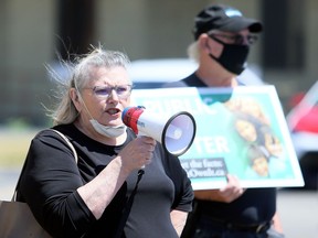Chatham-Kent Health Coalition chairperson Shirley Roebuck speaks during a protest about issues in long-term care homes outside MPP Rick Nicholls's office in Chatham on Wednesday. Mark Malone
