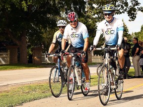 Joseph Sebben, Randy Perdu and Rand MacIntosh ride their bicycles along Phase 1 of the Round the River Recreational Trail along Grand Avenue West in Chatham in August 2019. (Tom Morrison/Postmedia Network)