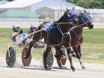 Horses run down the homestretch during the Dresden Raceway season opener in Dresden, Ont., on Sunday, June 7, 2020. (Mark Malone/Chatham Daily News)