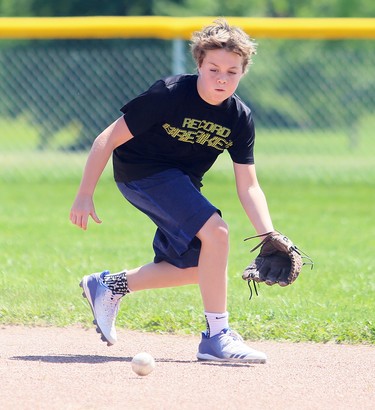 Carter Graham, 12, fields a grounder during a family baseball outing at Blythe Park in Chatham, Ont., on Monday, June 15, 2020. Mark Malone/Chatham Daily News/Postmedia Network