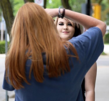 Tristan Reaume poses for photographer Ella Dam in downtown Chatham in Chatham, Ont., on Friday, June 26, 2020. Dam volunteered her services to FreeHelpCK, which held a drive-up prom for Grade 12 students whose school prom was cancelled because of the COVID-19 pandemic. Reaume is in Grade 12 at Ursuline College Chatham. Mark Malone/Chatham Daily News/Postmedia Network