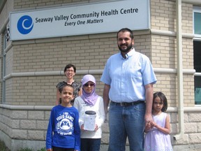 From left, with dad Dr. Owais Aziz, are Mussab, Zara and Fatimah, with Seaway Valley Community Health Centre executive director Debbie St. John-de Wit in back. Photo on Thursday, June 4, 2020, in Cornwall, Ont. Todd Hambleton/Cornwall Standard-Freeholder/Postmedia Network