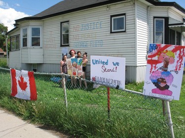 Residents along the protest route getting ready to support the marchers. Photo on Saturday, June 6, 2020, in Cornwall, Ont. Todd Hambleton/Cornwall Standard-Freeholder/Postmedia Network