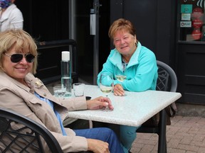 Rhona Bourgon and Angele Lafrance enjoy drinks at Schnitzels as patios open on Friday June 12, 2020 in Cornwall, Ont. Joshua Santos/Cornwall Standard-Freeholder/Postmedia Network