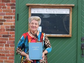 Gail Parker of the Heritage Centre in Chesterville presents a copy of "The Time That Was" on June 18 2020 which chronicles the story of Chesterville since its beginning until 1977. Handout/Cornwall Standard-Freeholder/Postmedia Network