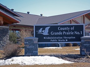 A sign outside the County of Grande Prairie administration office in Clairmont, Alta. Saturday, April 18, 2020.