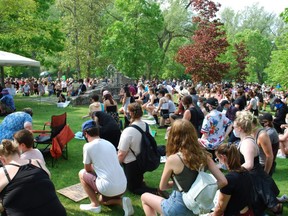 Participants of Wednesday's Owen Sound Solidarity March for Black Lives Matter kneel together at the Owen Sound Black History Cairn in honour of George Floyd. DENIS LANGLOIS