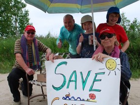 Members of the Ives family, who are seasonal residents at Sauble, take part in Saturday's Towel Day of Resistance. DENIS LANGLOIS