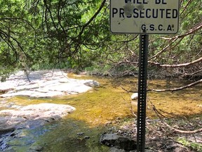 Sign at Eugenia Falls warning people to stay in authorized areas. A boy hurt himself while on an unauthorized route to the bottom and was taken to a London hospital with suspected broken legs Tuesday. (Grey Sauble Conservation Authority photo)