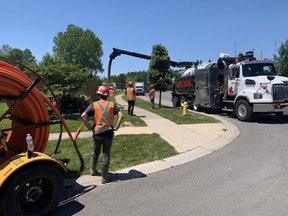 A construction crew continued underground work Wednesday on Brantwood Park Road where a gas line was damaged on Tuesday morning, causing residents to be evacuated and about 40 homes to be without gas overnight.