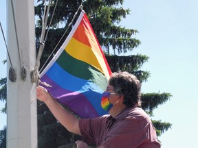 Prescott Mayor Brett Todd prepares to hoist the Gay Pride rainbow flag.
Wayne Lowrie/Recorder and Times