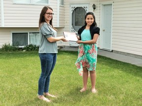 Valeria Vazquez (right) of High River won in the recognized in the Arts & Culture category of the Youth of Distinction Awards  and received her award on June 6 at her home.