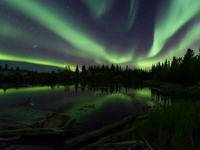 "Spectacle of the North" is a photo submitted to the campaign of the Northern Lights over K'alt'odeeche First Nation, Wood Buffalo National Park. Photo by Mark Jinks